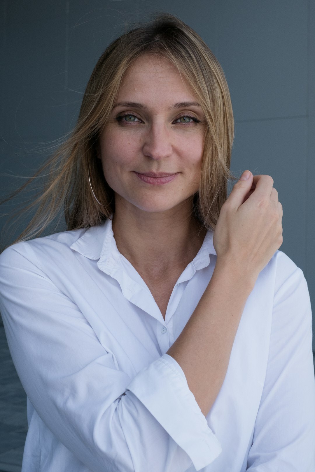 Studio portrait of a professional European woman in her forties smiling